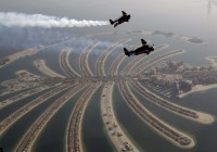 Two daredevils with jet packs soar above Duba